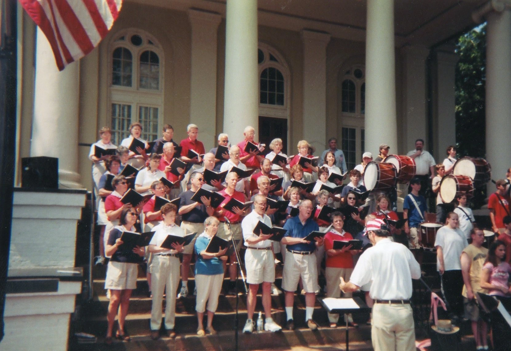 Steve Aiello conducting the chorale during a July 4th concert